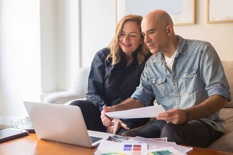 Husband and wife reviewing their documents for Making Tax Digital